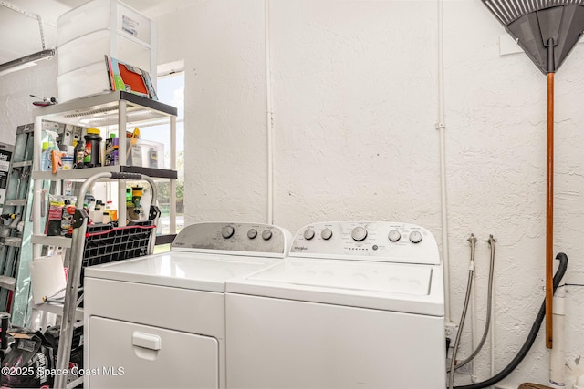 washroom with washer and clothes dryer