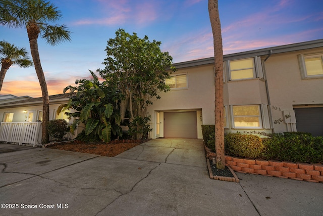 townhome / multi-family property featuring a garage