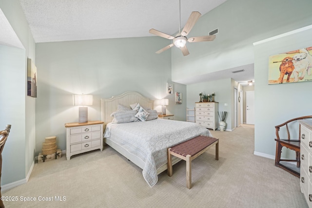 bedroom featuring high vaulted ceiling, light carpet, a textured ceiling, and ceiling fan