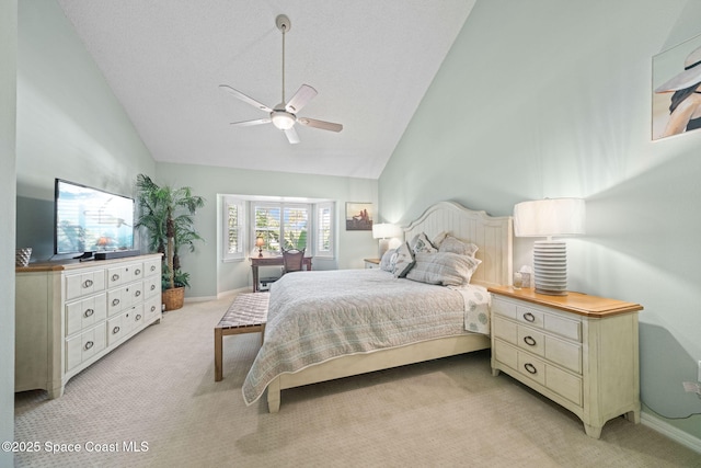 carpeted bedroom with high vaulted ceiling and ceiling fan