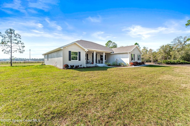 ranch-style house featuring a porch and a front yard