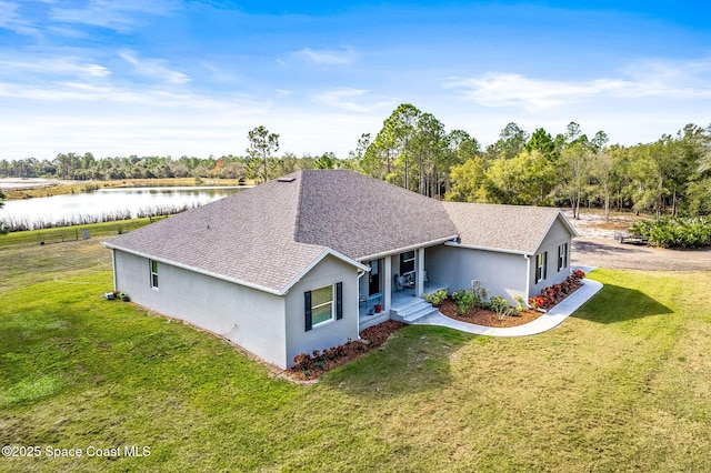 view of front of house featuring a water view and a front yard