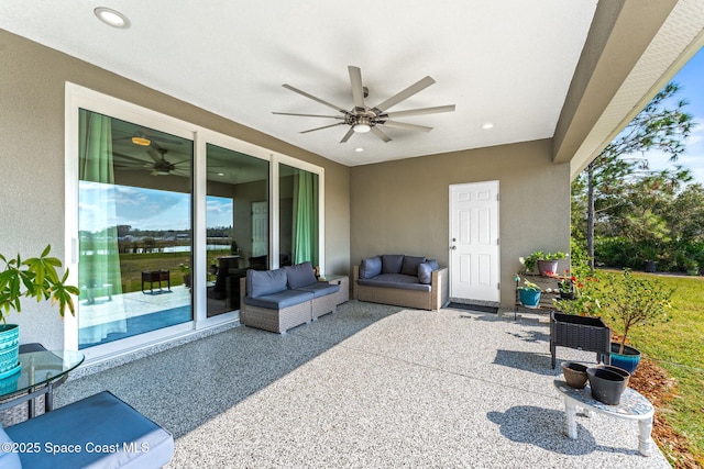 view of patio with outdoor lounge area and ceiling fan