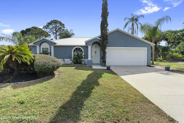 ranch-style home featuring a garage and a front lawn