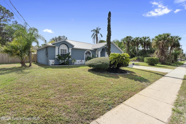 ranch-style home with a front yard