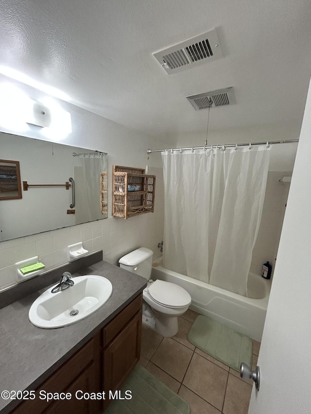 full bathroom with tile patterned flooring, tasteful backsplash, vanity, shower / bath combination with curtain, and toilet