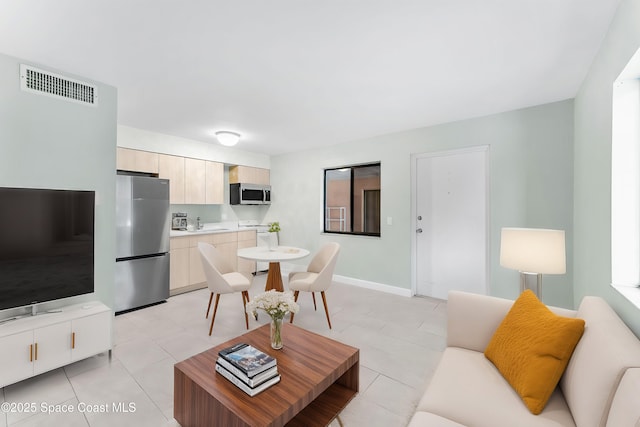 living room with light tile patterned floors