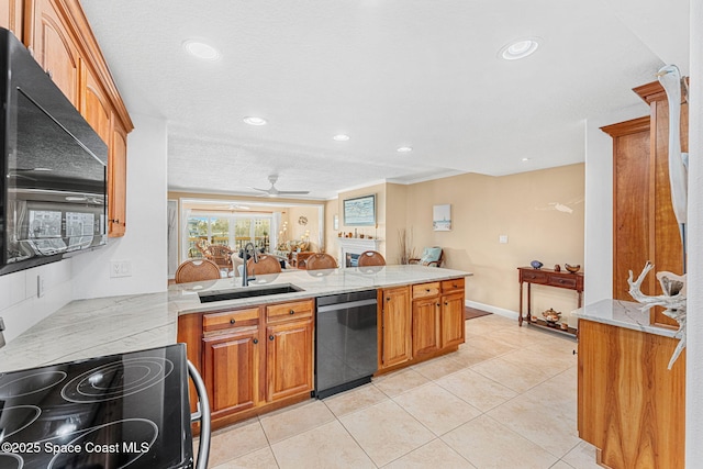 kitchen featuring black dishwasher, sink, light tile patterned floors, electric range, and kitchen peninsula