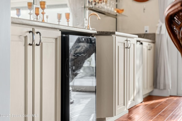 mudroom featuring wood-type flooring and beverage cooler