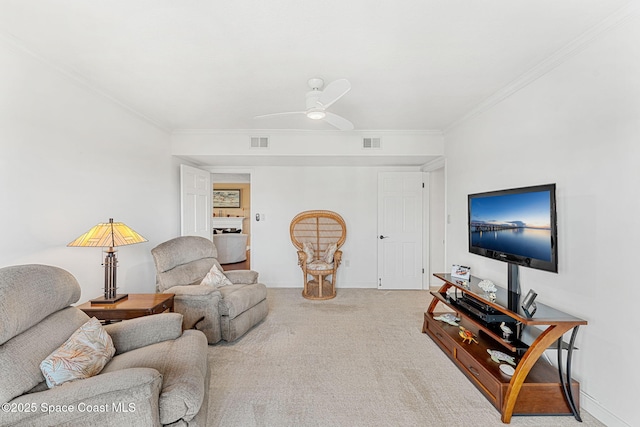 living room featuring crown molding, carpet floors, and ceiling fan