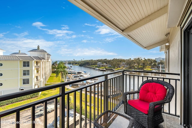 balcony featuring a water view