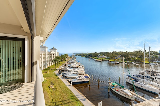 exterior space featuring a water view and a balcony