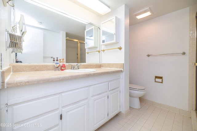 bathroom with vanity, an enclosed shower, tile patterned floors, and toilet