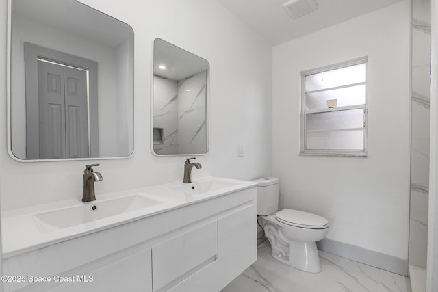 bathroom with vanity and toilet