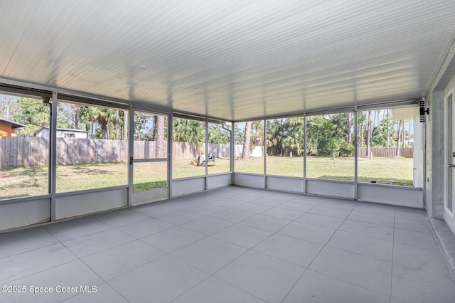 unfurnished sunroom featuring a wealth of natural light