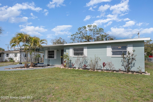 ranch-style home with a front lawn