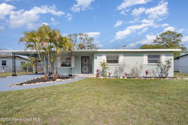 ranch-style home with a front lawn and a carport