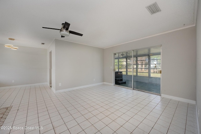 tiled empty room featuring crown molding and ceiling fan