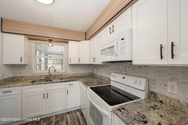 kitchen with white cabinetry and white appliances