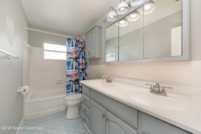 full bathroom with toilet, vanity, shower / bathtub combination with curtain, and tile walls