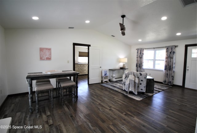 dining room with dark wood-style floors, vaulted ceiling, visible vents, and recessed lighting