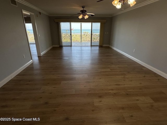 unfurnished room with crown molding, ceiling fan, and dark hardwood / wood-style floors