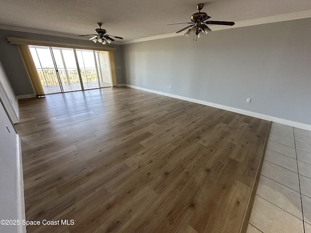 unfurnished room with hardwood / wood-style flooring, ornamental molding, ceiling fan, and a textured ceiling