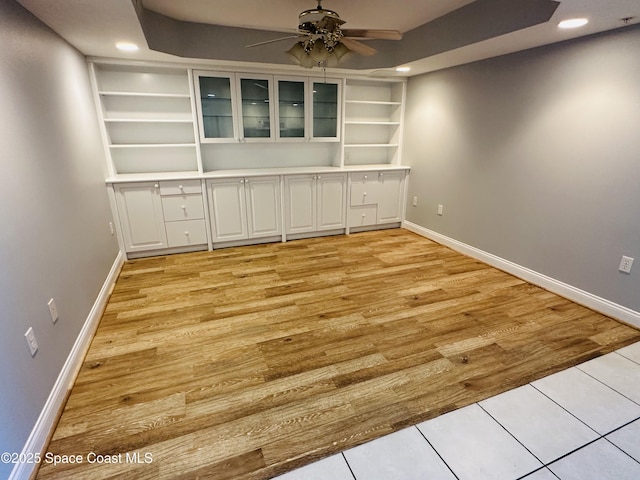 spare room with ceiling fan and light hardwood / wood-style floors