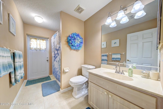 bathroom featuring vanity, walk in shower, toilet, tile patterned floors, and a textured ceiling