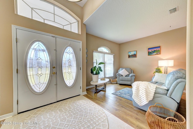 foyer with light hardwood / wood-style floors