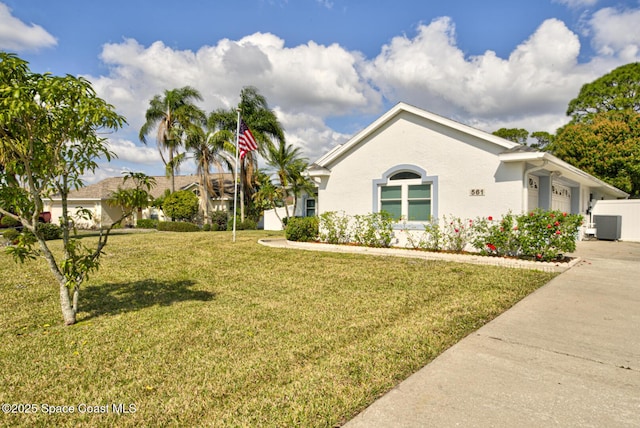 single story home with a garage and a front yard