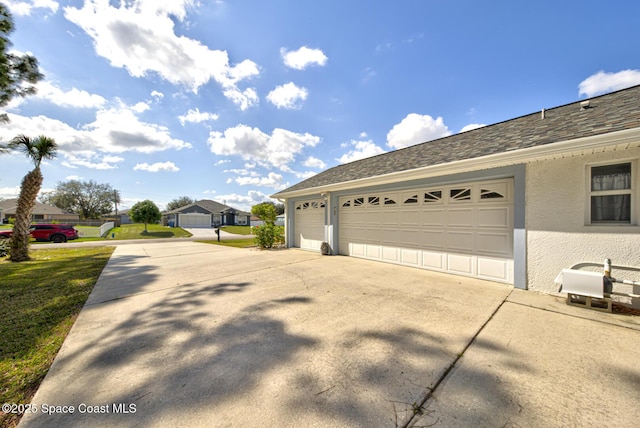 view of side of home featuring a garage