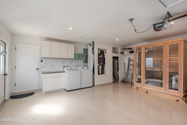 interior space featuring a garage door opener and washing machine and dryer