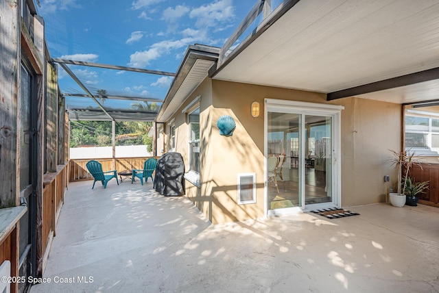 view of patio with a lanai