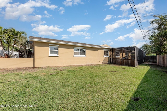 back of house with a yard