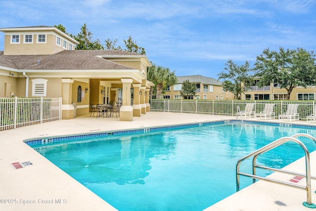 view of swimming pool featuring a patio