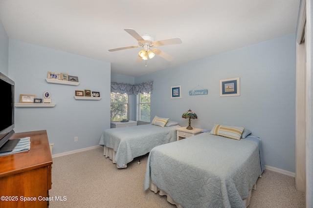 bedroom with light carpet and ceiling fan