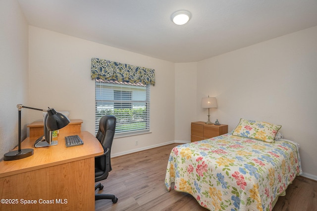 bedroom featuring hardwood / wood-style floors