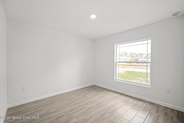 1305 Harper Blvd SW, Palm Bay, FL 32908 - spare room with wood finish floors, baseboards, and a smoke detector