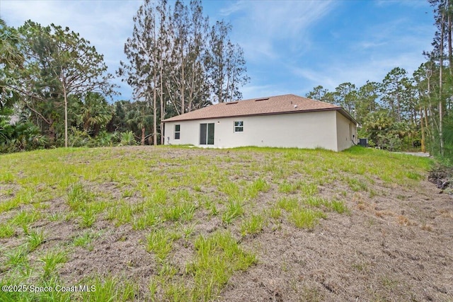 1305 Harper Blvd SW, Palm Bay, FL 32908 - rear view of house featuring stucco siding