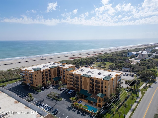 aerial view with a view of the beach and a water view