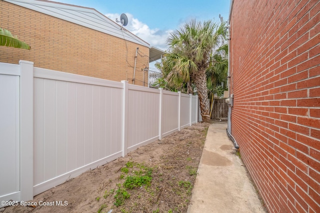 view of home's exterior with fence