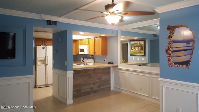 kitchen featuring ornamental molding, ceiling fan, and white appliances