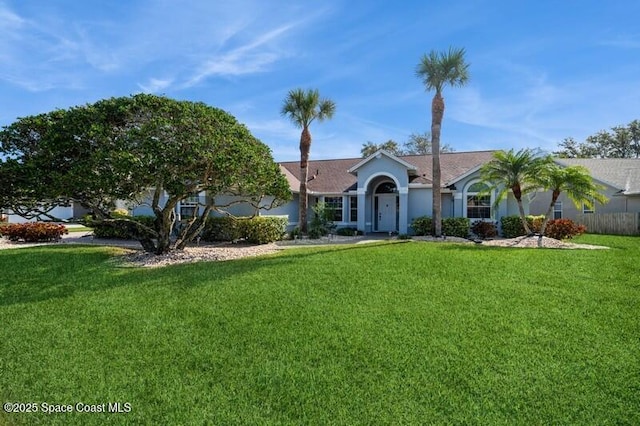 ranch-style home with a front lawn