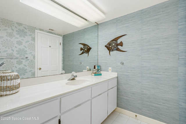 bathroom with vanity, visible vents, and tile patterned floors