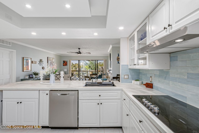 kitchen with crown molding, black electric stovetop, a sink, dishwasher, and a peninsula