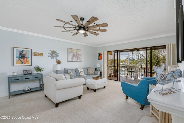 living area with ceiling fan, ornamental molding, and light colored carpet