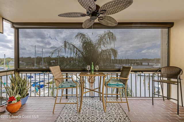 sunroom / solarium with ceiling fan