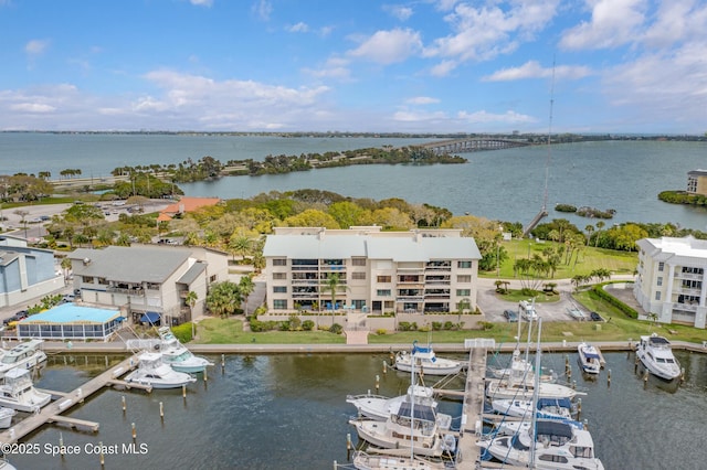 birds eye view of property featuring a water view