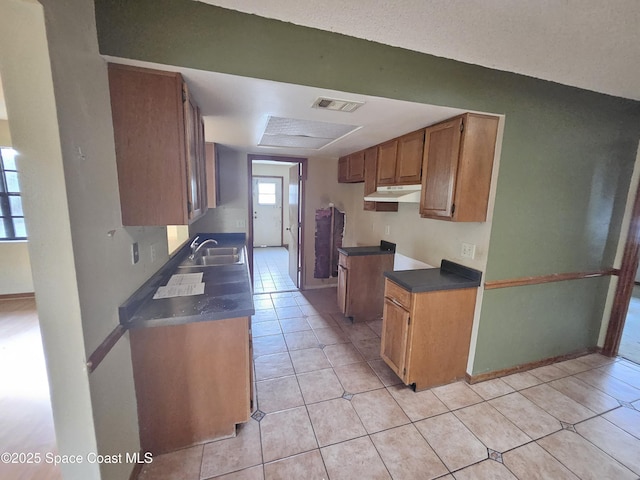 kitchen with sink and light tile patterned floors